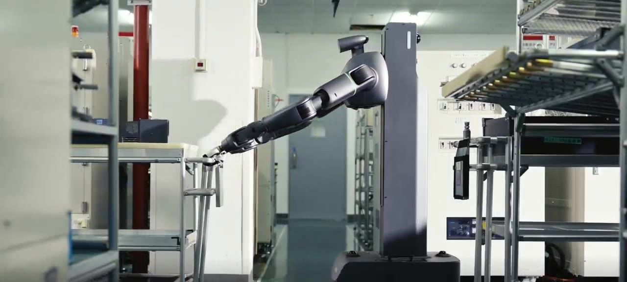 Robot reaching its arm into a rack of trays in a factory aisle
